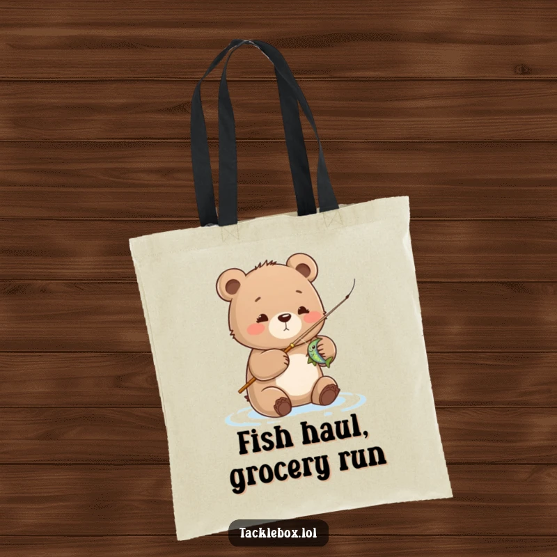 Funny bear cub tote bag, showcasing a cute cub reeling in a fish, perfect for fishing trips and everyday humor.